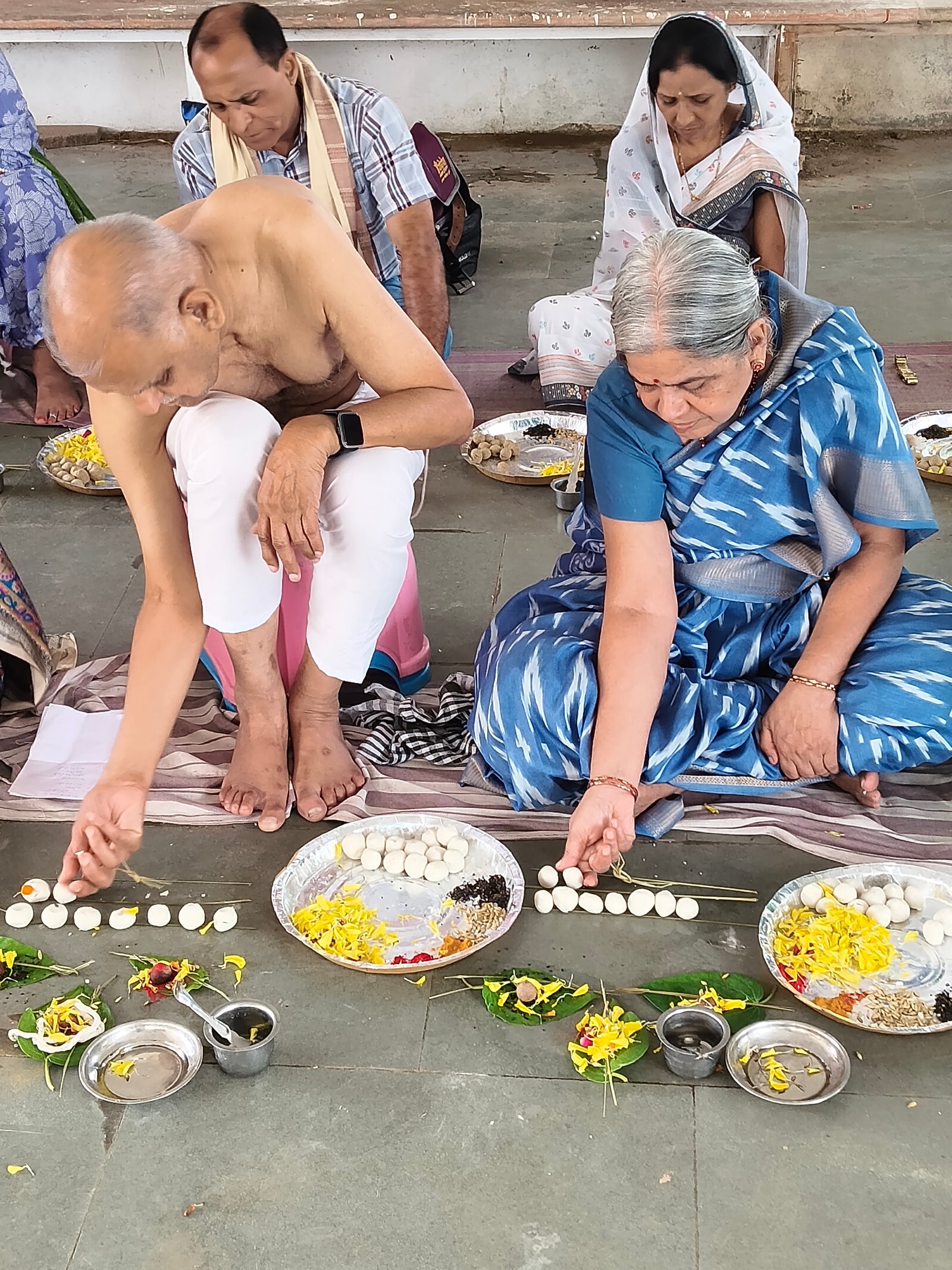 Devotees Performing Group Pooja at Bindu Sarovar